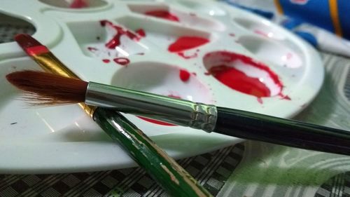 High angle view of paintbrushes on table