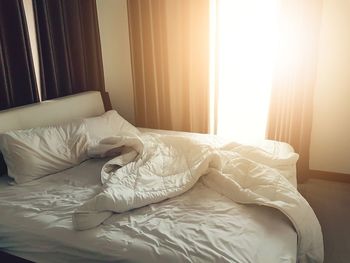 White curtain on bed at home