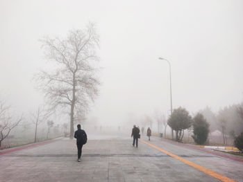 People walking on the road on a foggy day , turkey .