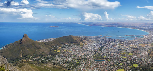 High angle view of sea and buildings against sky