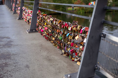 High angle view of love locks on railing