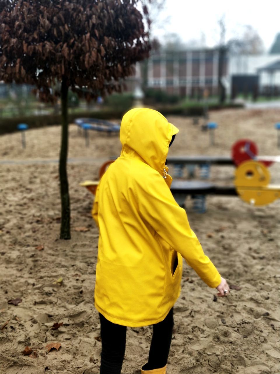 REAR VIEW OF A YELLOW MAN