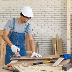 Carpenter working at work shop