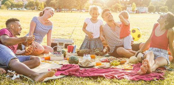 View of family at picnic on field