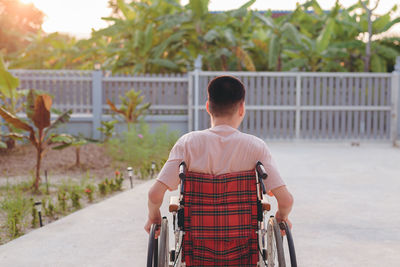 Rear view of woman standing in park