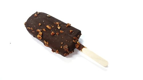 Close-up of chocolate cake against white background