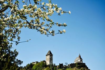 Low angle view of built structure against clear blue sky