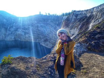 Portrait of woman against mountain