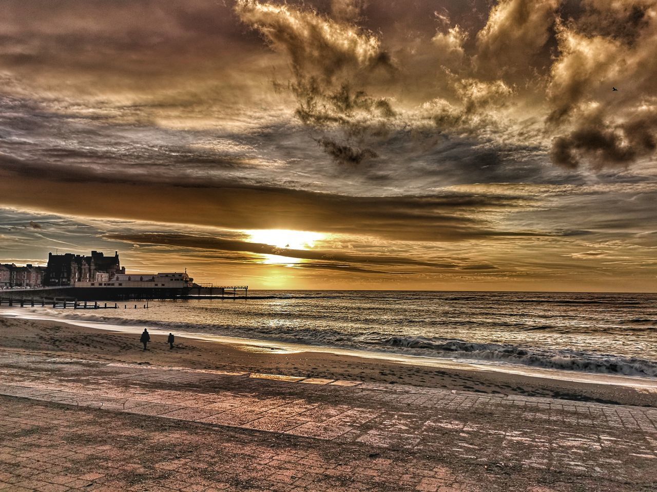 SCENIC VIEW OF BEACH DURING SUNSET