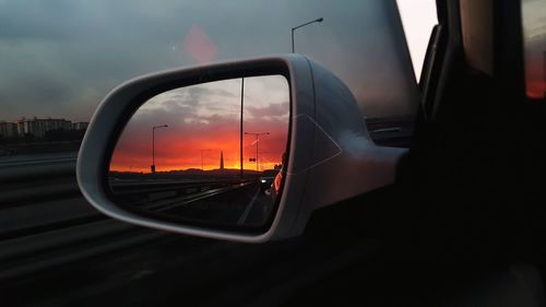 Reflection of car on side-view mirror