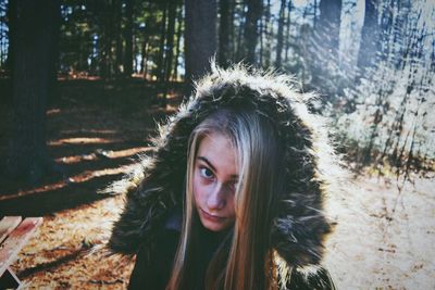 Portrait of young woman in forest