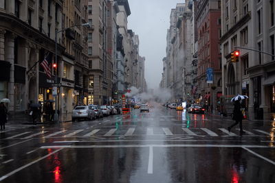 Wet street in city