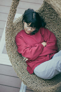 High angle view of girl resting at home