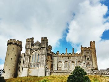 Historic building against cloudy sky