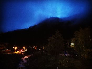 Scenic view of landscape against sky at night