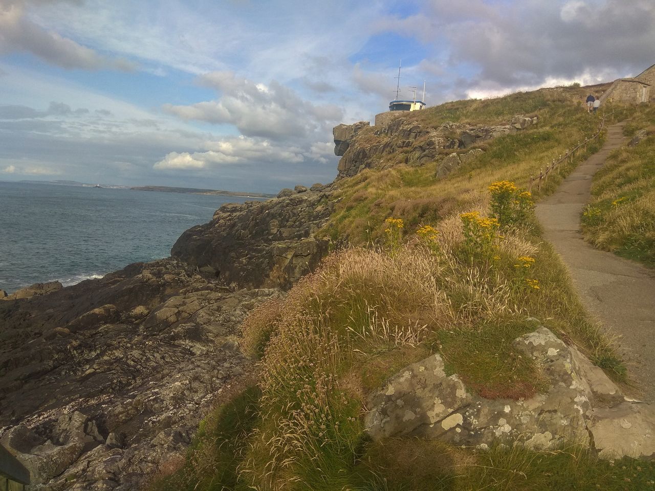 sky, sea, water, cloud - sky, scenics - nature, beauty in nature, tranquil scene, tranquility, land, nature, rock, horizon over water, no people, beach, horizon, non-urban scene, day, mountain, solid, outdoors, rocky coastline