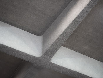 Low angle view of concrete cross on ceiling