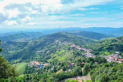 High angle view of townscape and mountains against sky