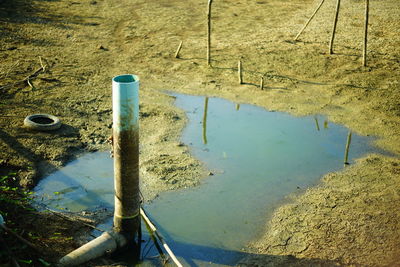 High angle view of wooden post in lake