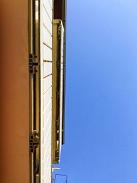 Low angle view of building against clear blue sky