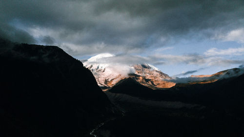 Scenic view of snowcapped mountains against sky