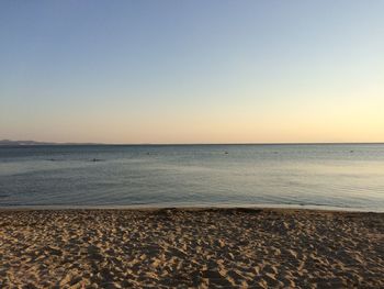 Scenic view of beach against clear sky