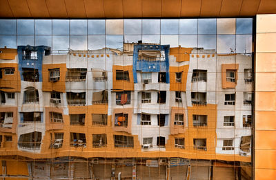 Low angle view of buildings in city against sky
