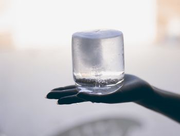 Close-up of hand holding wine glass