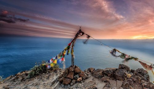 Scenic view of sea against sky at sunset