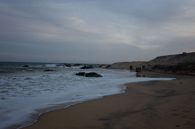 Scenic view of beach against sky