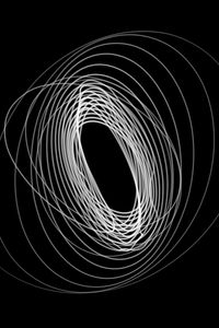 Close-up of spiral light against black background