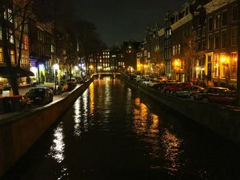 Illuminated bridge at night