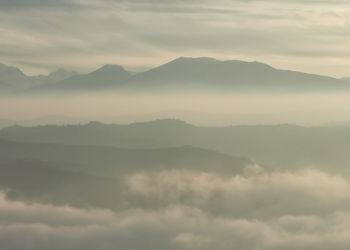 Scenic view of mountains against sky during sunset