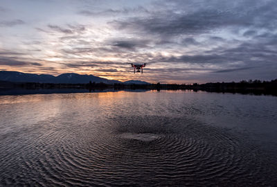 Silhouette drone during sunset