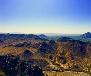 Scenic view of mountains against clear blue sky