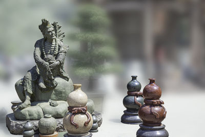 Close-up of buddha statue against the background