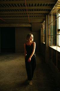 Portrait of young woman looking at camera