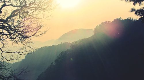 Scenic view of mountains against sky during sunset