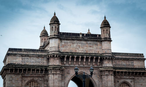 Low angle view of gateway of india against sky
