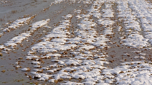 High angle view of wet sand on beach