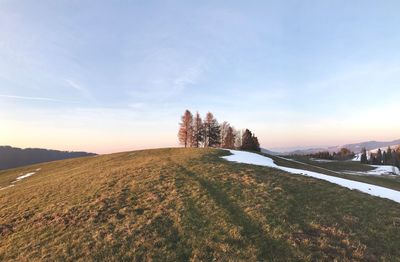 Scenic view of landscape against sky during sunset