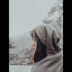 Portrait of man looking away against sky