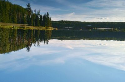 Reflection of clouds in calm lake