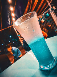 Close-up of beer glass bottle on table