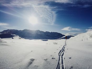 Scenic view of snow covered mountains against sky