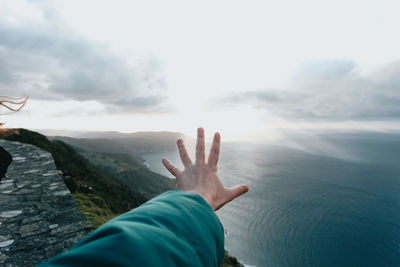 Midsection of person against sky