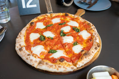 High angle view of pizza on table in restaurant