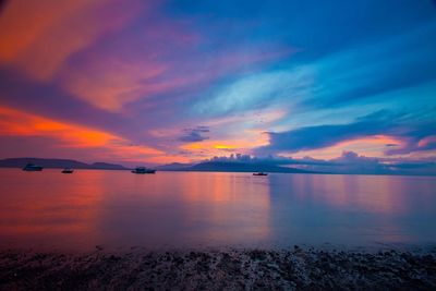 Scenic view of dramatic sky over sea during sunset