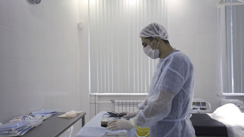 Side view of man working at home