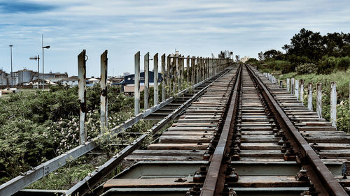 Railroad tracks against sky